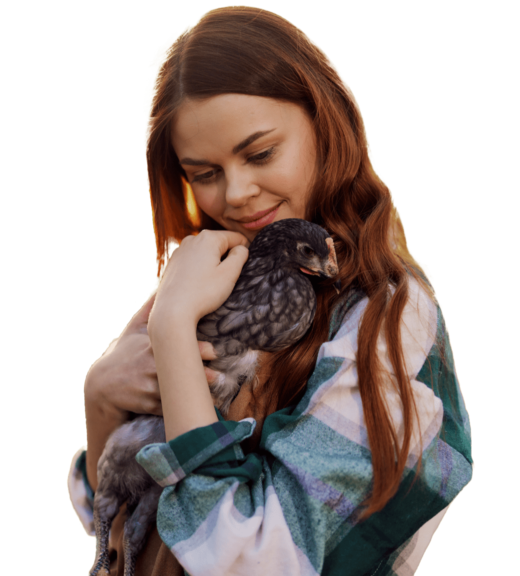 happy-young-woman-smiles-camera-holds-young-chicken-that-lays-eggs-her-farm-sunlight 1-min